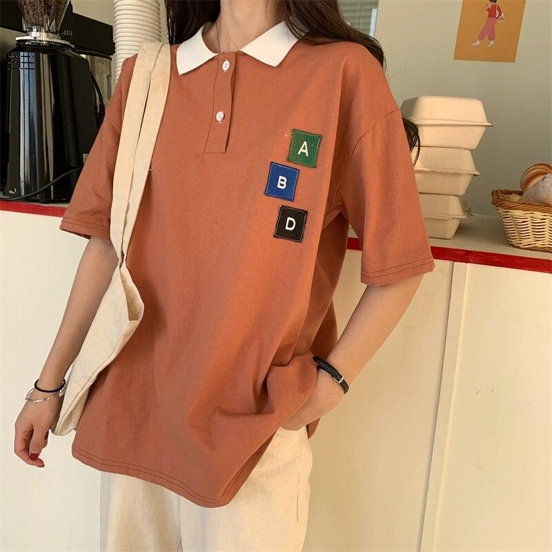 Damska koszulka polo z naszywkami-Bombardina.pl